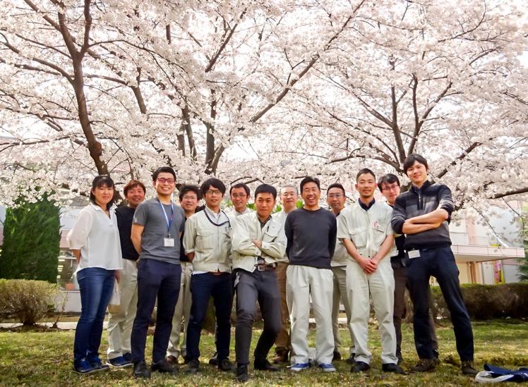 A group of people posing for a photo Description automatically generated with medium confidence